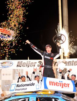 Joey Logano celebrates in victory lane, which is his third consecutive victory at Kentucky Speedway. Credit: Grant Halverson/Getty Images